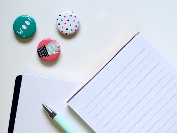 notebook and pins | 7 Ways to Crush Your LifeGoals This Year https://positiveroutines.com/crush-lifegoals/