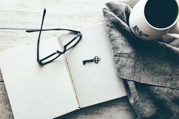 antique key laying in open notebook | How to Take Advantage of a Flexible Schedule https://positiveroutines.com/flexible-schedule-tips/