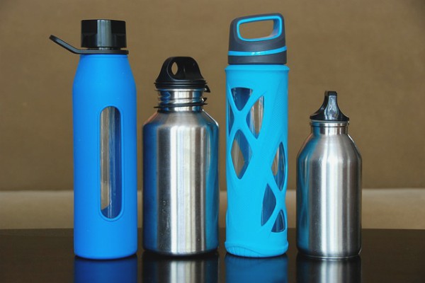 assortment of aluminum and glass water bottles | 11 Things You Need to Have a Productive Day https://positiveroutines.com/have-a-productive-day/