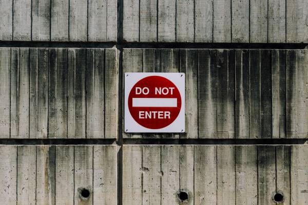 do not enter sign on weathered wood wall | 11 Things You Need to Have a Productive Day https://positiveroutines.com/have-a-productive-day/