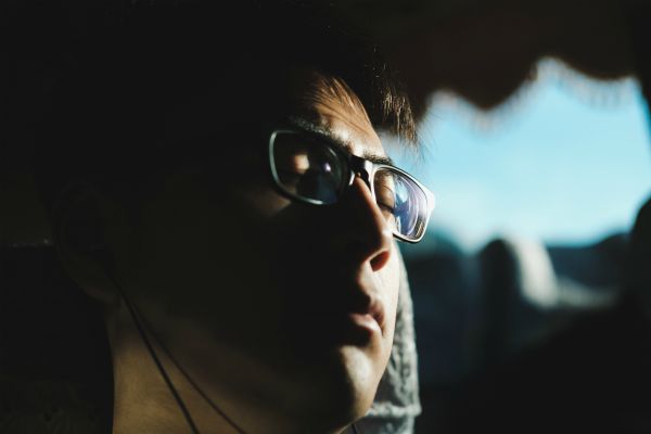 man asleep on bus | How to Take Advantage of a Flexible Schedule https://positiveroutines.com/flexible-schedule-tips/