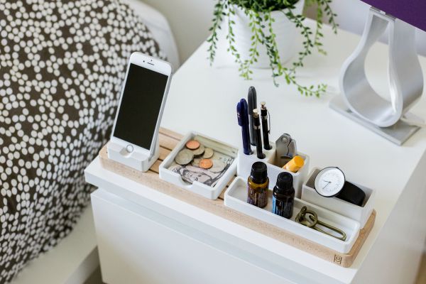 nightstand with phone watch and personal items organized | Make These 5 Tiny Tweaks to Have A Great Morning https://positiveroutines.com/great-morning-tips/