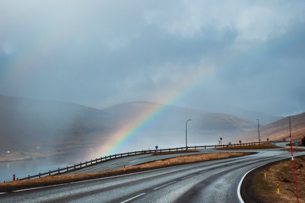 rainbow peaking through grey clouds | 7 Easy Ways to Build a More Positive Mindset https://positiveroutines.com/positive-mindset/