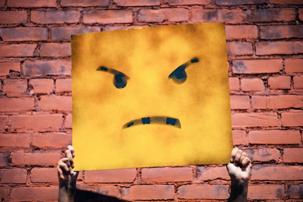 angry face illustrated on sign| What is Procrastination? Causes, Effects, & How to Stop Procrastinating https://positiveroutines.com/what-is-procrastination/