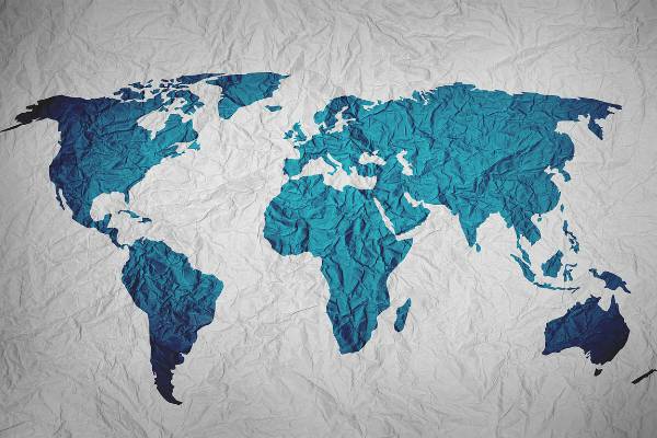 blue world map on wrinkled material | The Happiest Country in the World This Year is... https://positiveroutines.com/happiest-country-in-the-world/