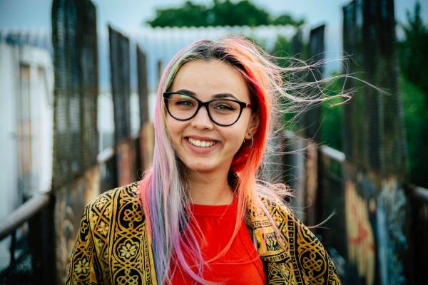 confident woman with unique colorful hair | What is Procrastination? Causes, Effects, & How to Stop Procrastinating https://positiveroutines.com/what-is-procrastination/