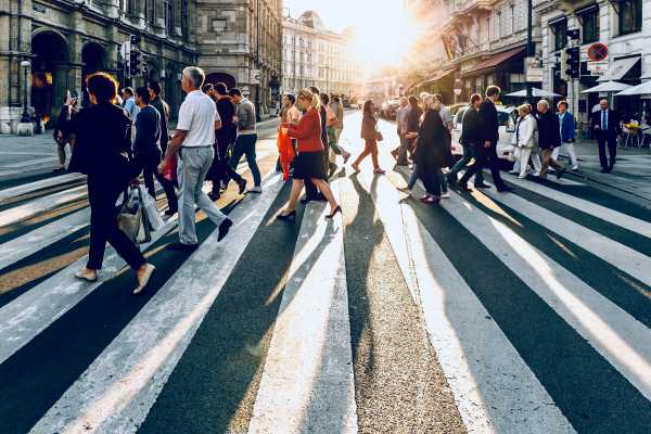 crowd of people crossing city street | What is Procrastination? Causes, Effects, & How to Stop Procrastinating https://positiveroutines.com/what-is-procrastination/
