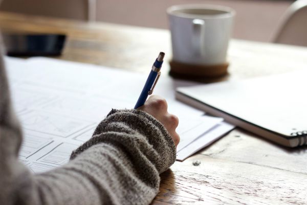 person writing in journal | 6 Surprising Things to Add To Your Everyday Routine https://positiveroutines.com/everyday-routine-hacks/