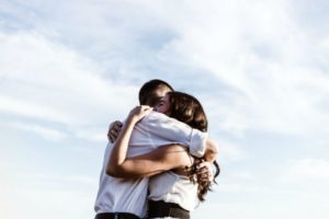 two friends giving big hug | 6 Surprising Things to Add To Your Everyday Routine https://positiveroutines.com/everyday-routine-hacks/
