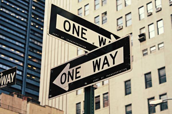 two intersecting one way signs | An Email Organization Tip for Real People + Why We’re Totally On Board https://positiveroutines.com/email-organization-strategy/