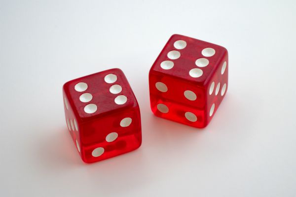 two red dice | The Curious Case of Success and Luck https://positiveroutines.com/success-and-luck/
