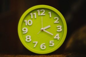 bright green analog clock | How to Stop Feeling Guilty For Not Getting "Enough" Work Done https://positiveroutines.com/stop-feeling-guilty/