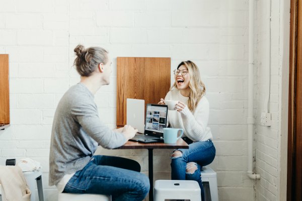 colleagues taking a break laughing | 7 Ways Downtime at Work Makes You More Productive https://positiveroutines.com/downtime-at-work