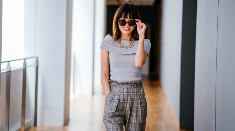 happy business woman wearing sunglasses | This is Why We're Happier in Summer https://positiveroutines.com/happier-in-summer