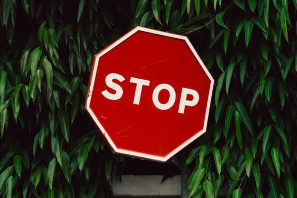 stop sign | Is Work and Life Balance Even Achievable in 2019? https://positiveroutines.com/work-and-life-balance-tips/