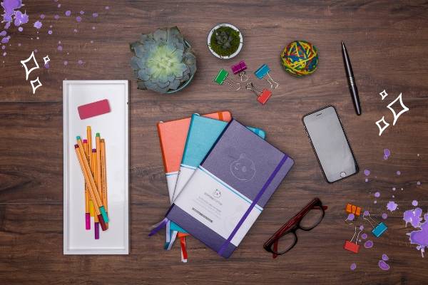 top view of desk with panda planners | What You Need to Know About Panda Planner's Back-to-School Giveaway https://positiveroutines.com/back-to-school-giveaway/