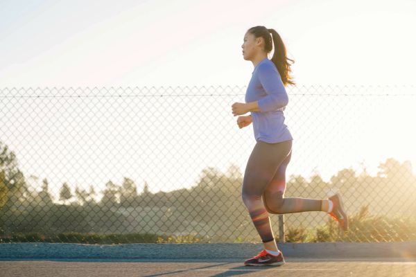 woman running outdoors | Is Work and Life Balance Even Achievable in 2019? https://positiveroutines.com/work-and-life-balance-tips/