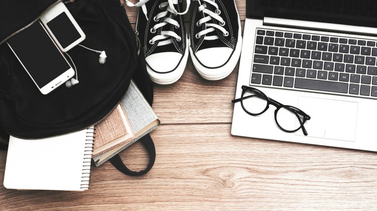 laptop and backpack of school supplies | 3 Back-to-School Essentials For A Better Year https://positiveroutines.com/back-to-school-essentials/