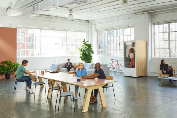 people working in an open modern office space | 7 Easy Ways to Create a Healthy Work Environment https://positiveroutines.com/work-environment-tips/