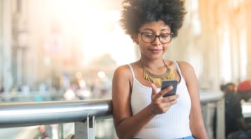 woman using mobile device | The Best Mental Health Apps To Help You Feel Good Right Now https://positiveroutines.com/best-mental-health-apps